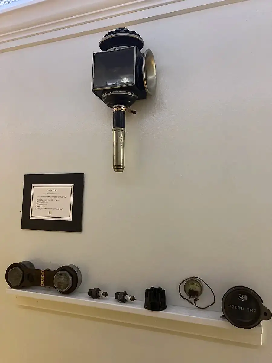 Antique carriage lamp and 1920s car parts
