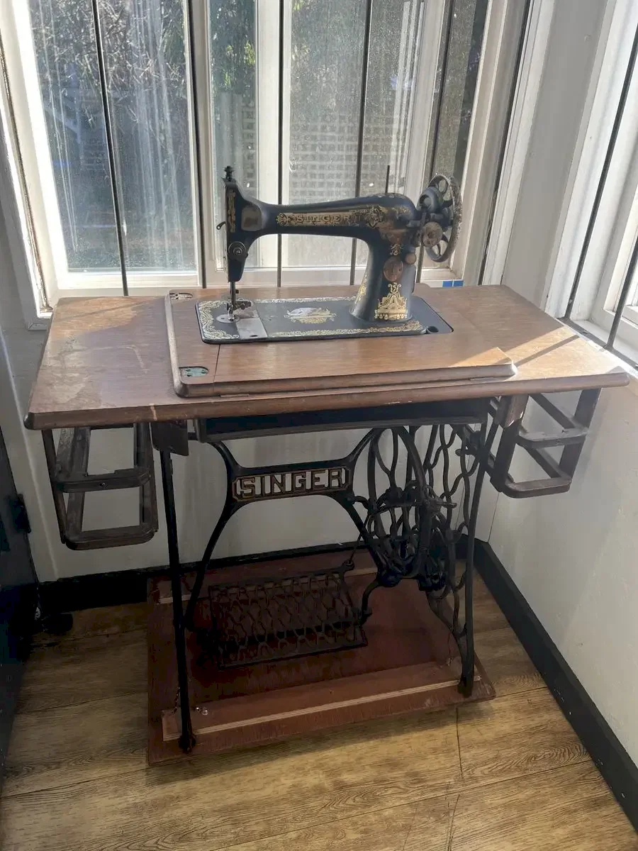 Antique Singer treadle sewing machine in upstairs room